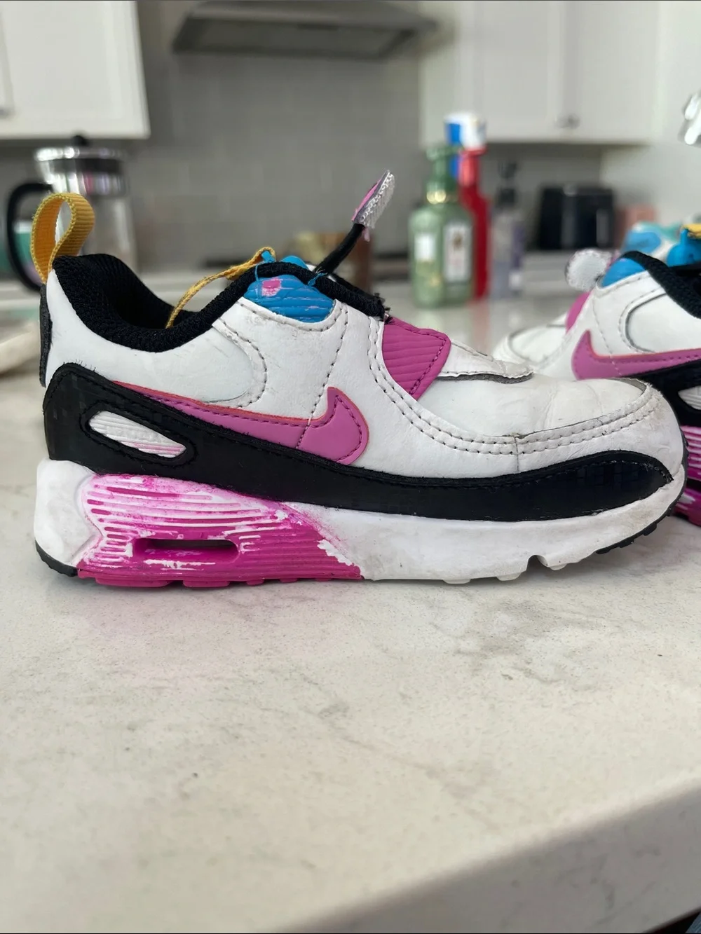Nike White Kids Sneakers with Pink, Blue & Yellow Accents